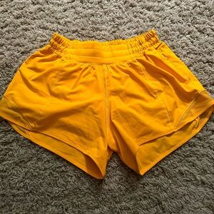 Lululemon hotty hot shorts 4” size 4 in a bright orange color.